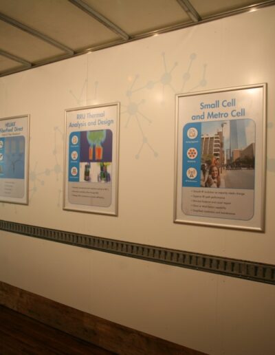 Educational posters displayed on a wall inside a trailer, with informative graphics and text.